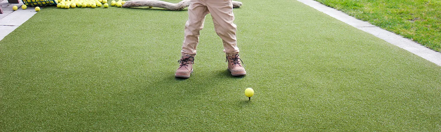 Golf ball on the tee on SYNLawn artificial grass