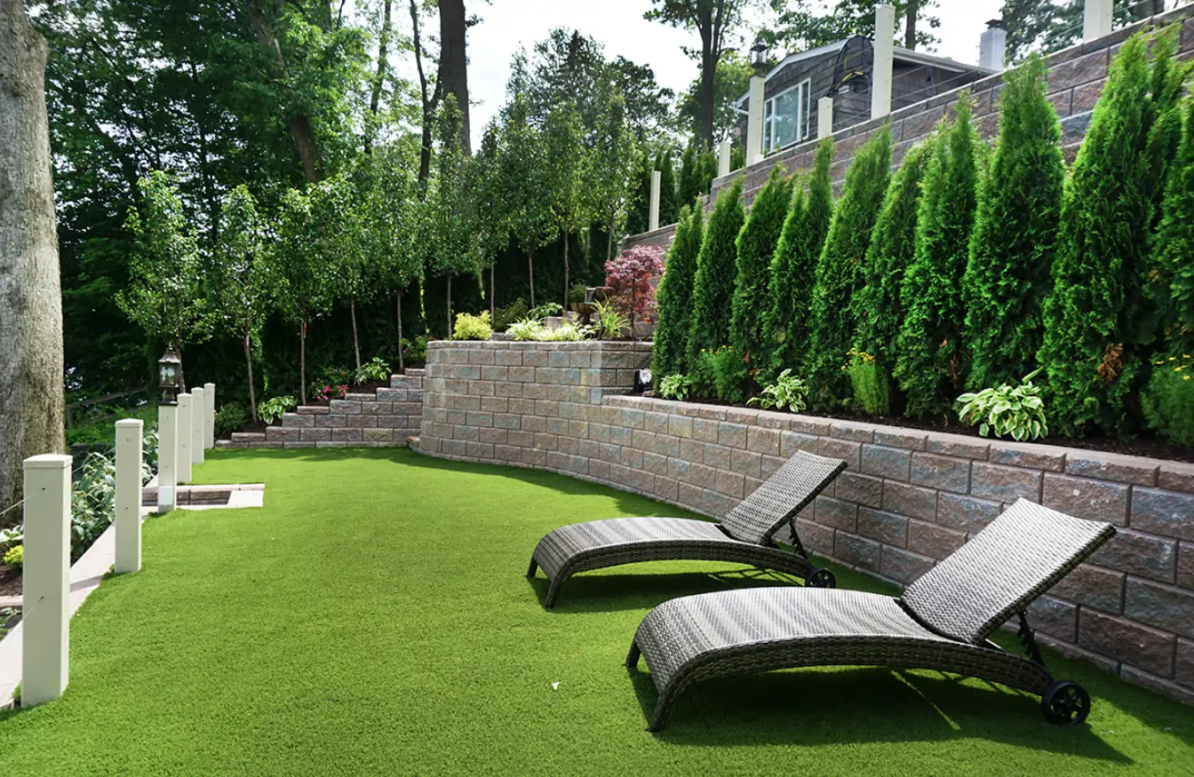 residential artificial grass lawn with lounge chairs