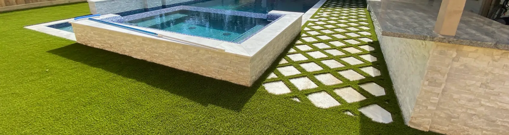 Backyard artificial grass pool deck installed by SYNLawn